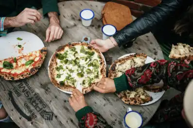 People enjoying pizza